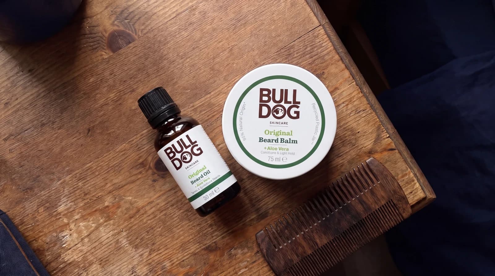 Bulldog Original Beard Oil 30ml and Beard Balm 75ml on a wooden dresser
