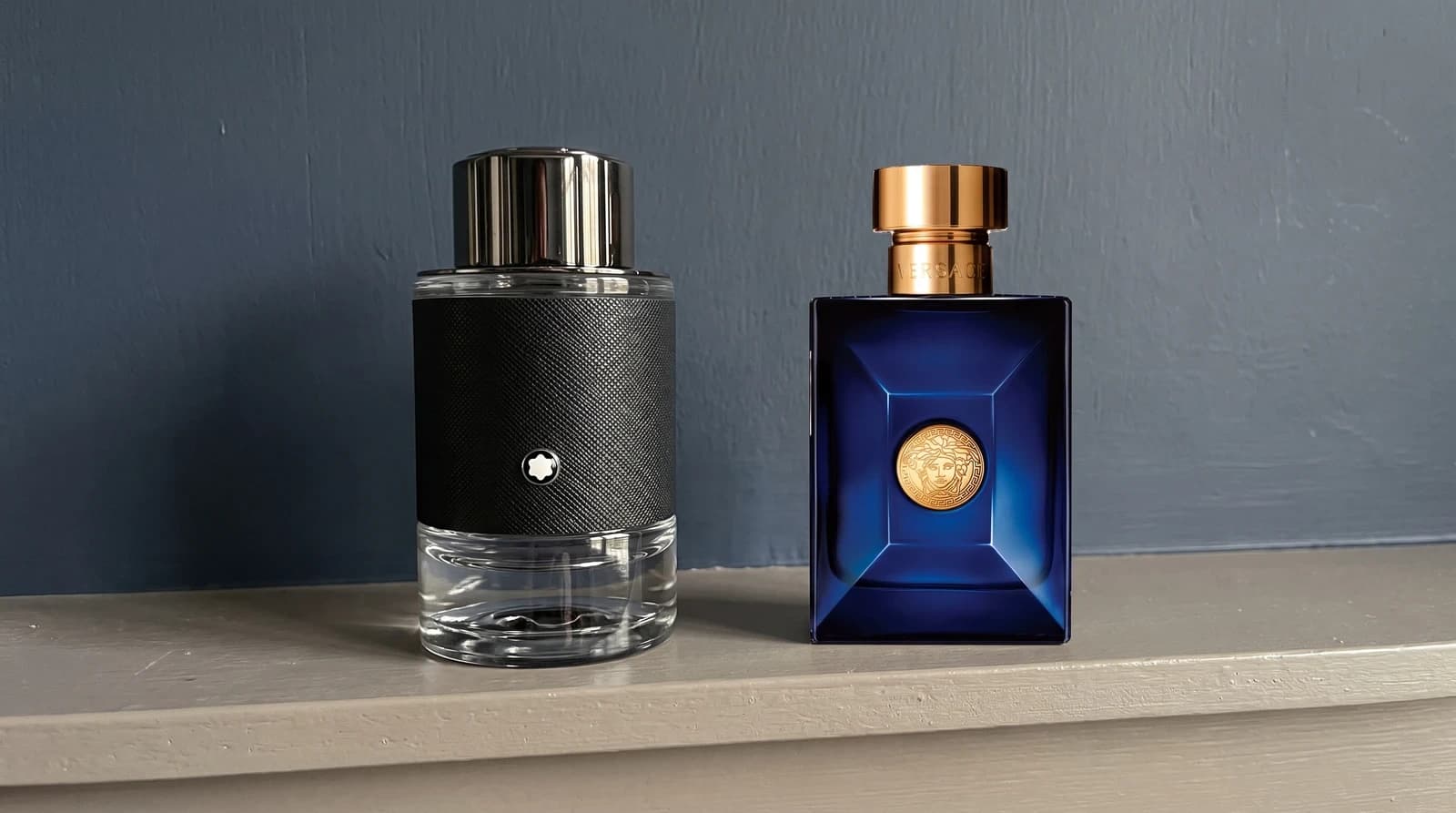 Montblanc Explorer EDP 60ml and Versace Dylan Blue EDT 50ml on a bedroom shelf