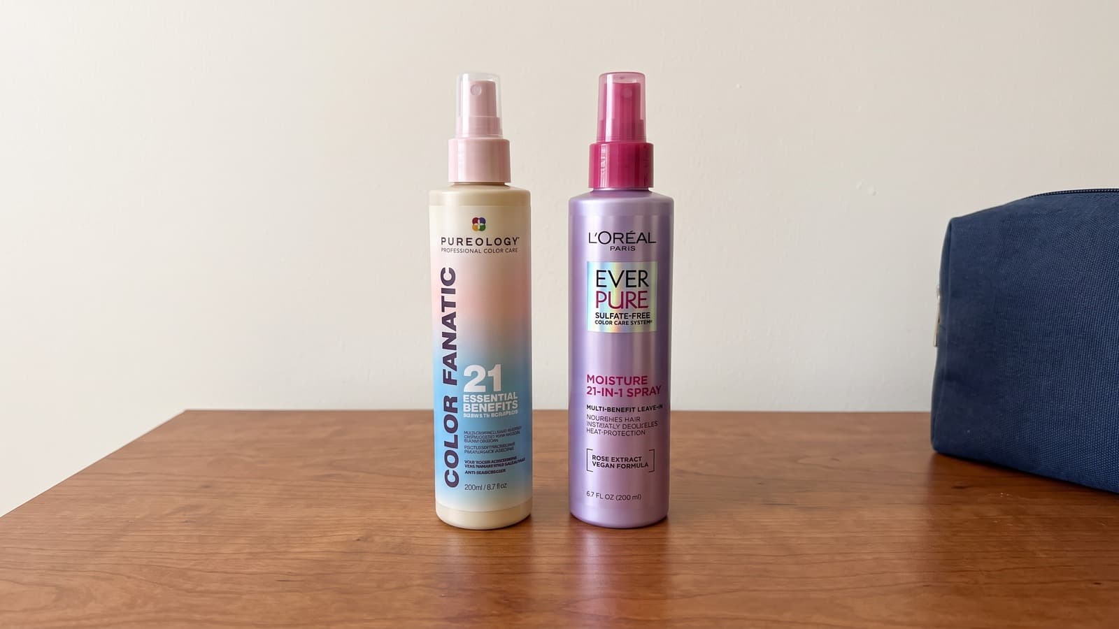 Pureology Color Fanatic and L’Oréal EverPure Moisture sprays on a wooden dresser