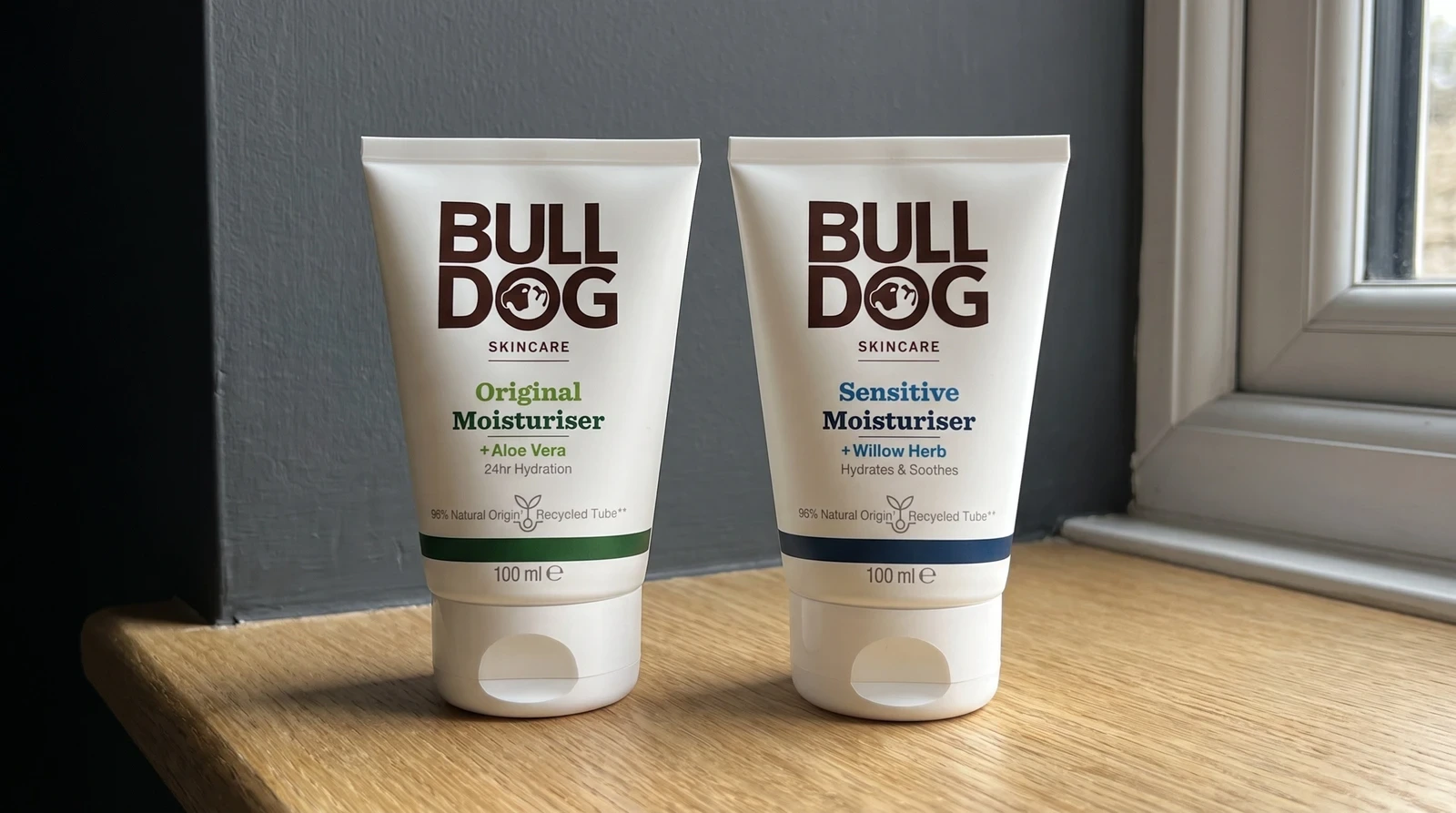 Bulldog Original and Sensitive moisturisers together on a wooden ledge