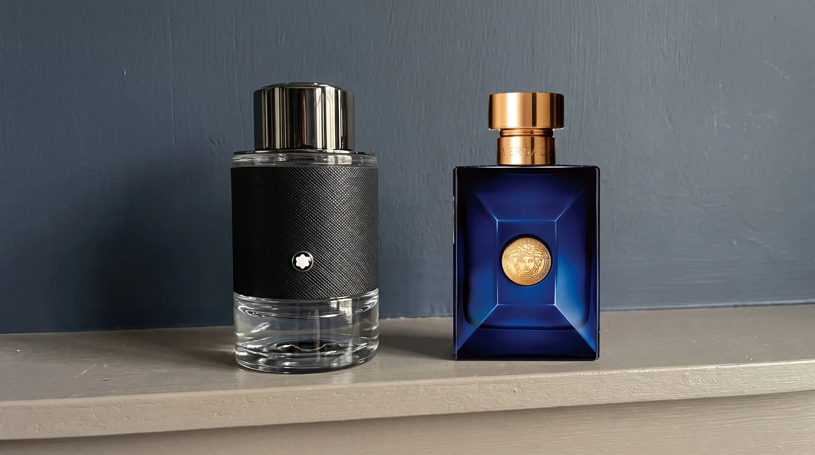 Montblanc Explorer and Versace Dylan Blue together on a shelf