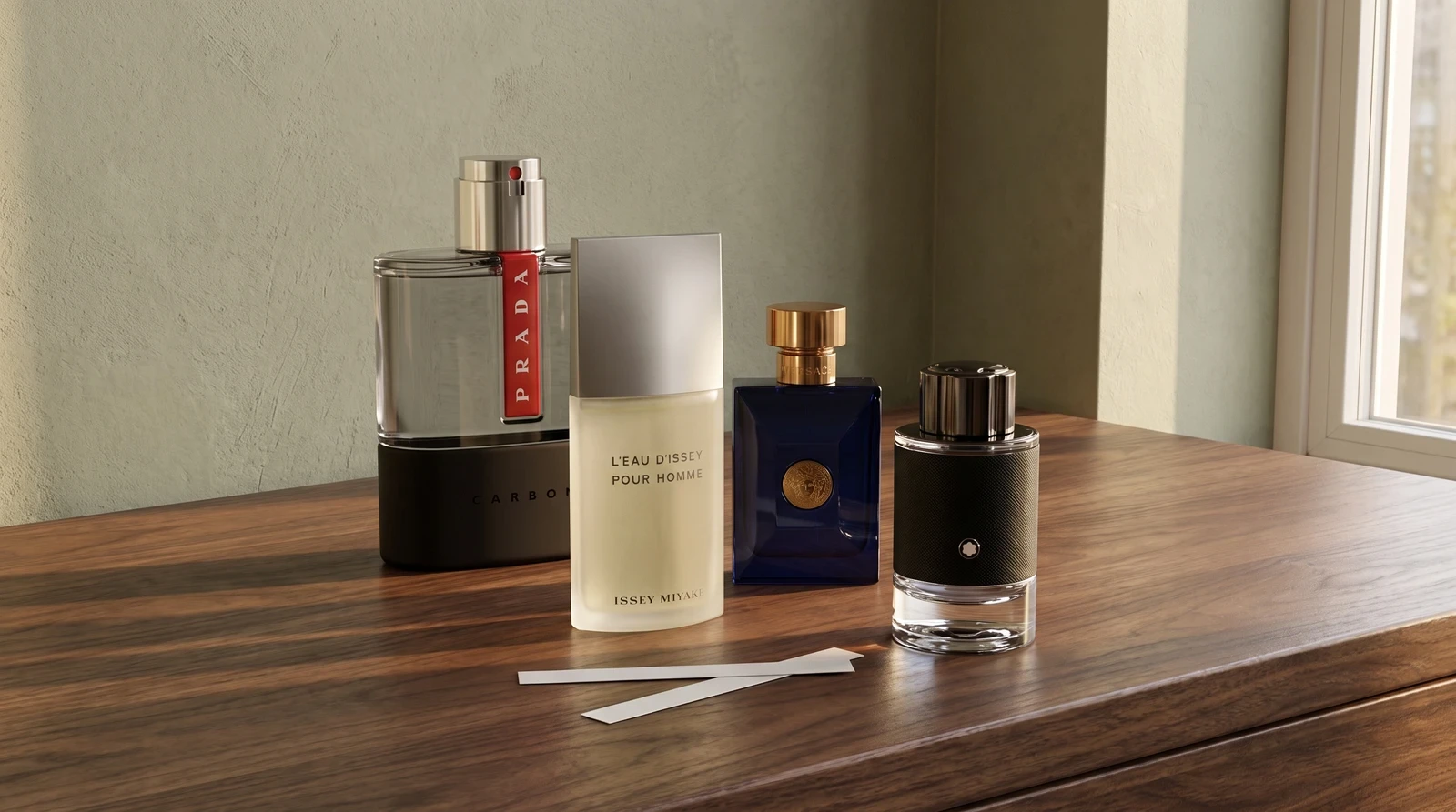 Four fragrance bottles arranged on a walnut dresser